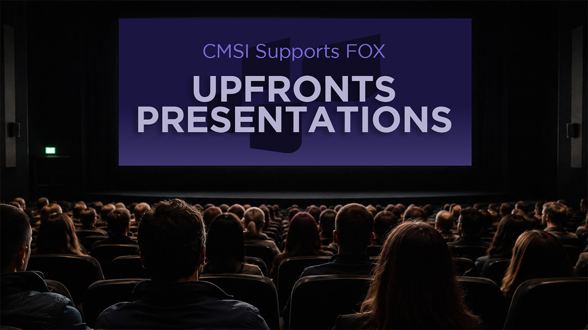 "CMSI Supports FOX Upfronts Presentations" words on a large movie theatre screen with a large audience facing the screen